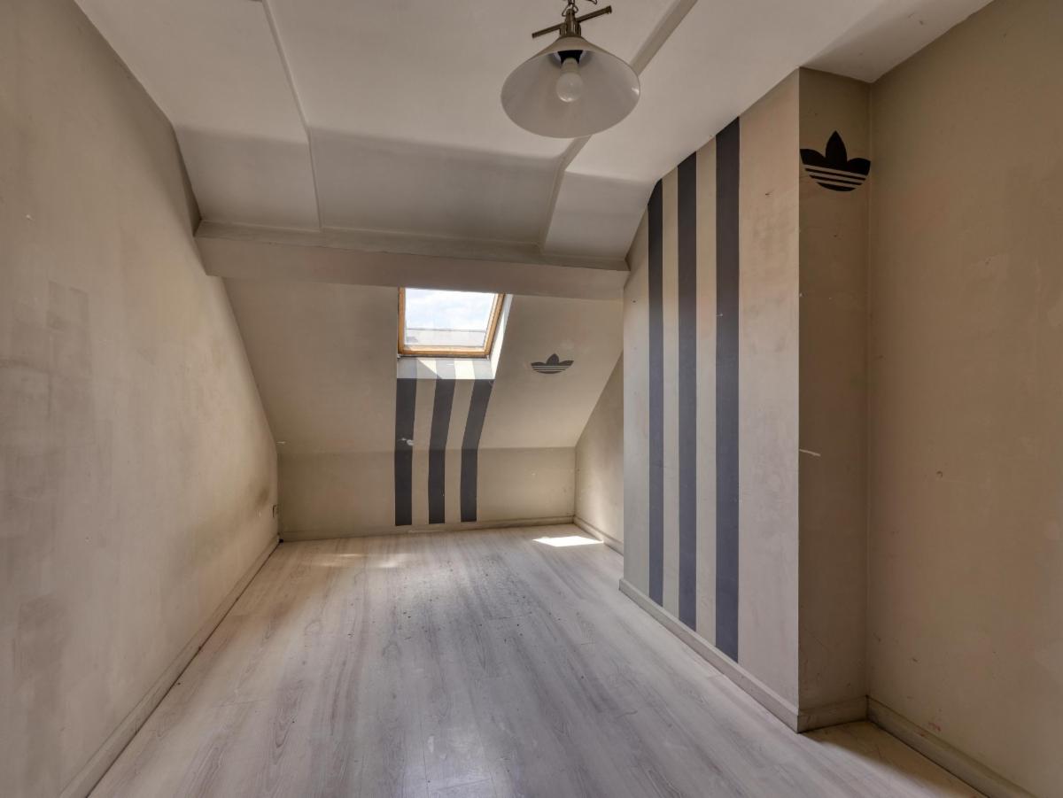 photo 7 du bien Une maison de rapport à 3 étages + combles mansardés