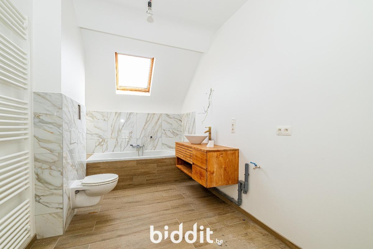 photo 16 du bien Une maison de rapport à 1 étage avec partie de jardin